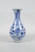 A Chinese blue and white porcelain pear shaped vase with scrolling floral decoration, 7½" high, A/