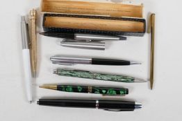 A Parker fountain pen and three Parker ballpoint pens together with four vintage propelling