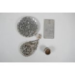 A collection of four Chinese white metal items to include a trinket dish with dragon decoration,