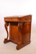 A Victorian burr walnut davenport, the slope with pierced gallery and inset leather top, the side