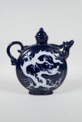 A Chinese blue and white porcelain wine jar/pourer with a phoenix head spout and incised dragon