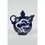 A Chinese blue and white porcelain wine jar/pourer with a phoenix head spout and incised dragon