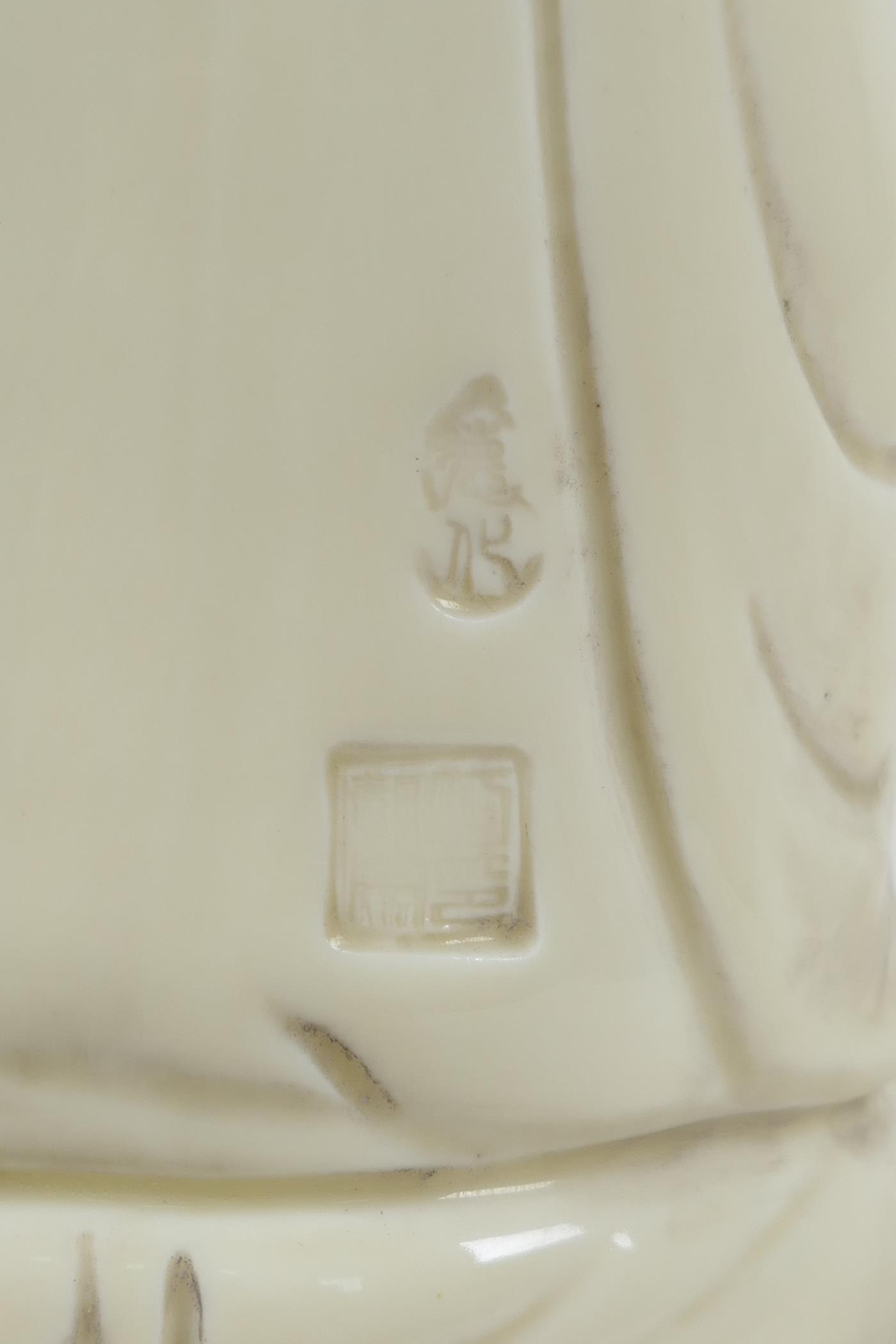 A Chinese blanc de chine porcelain Quan Yin seated on a lotus throne, impressed marks verso, 10½" - Image 5 of 6