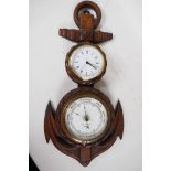 A nautical themed aneroid barometer and clock mounted in a carved oak rope and anchor frame, 21"