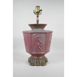 A pink glazed ceramic lamp with metal mounts, the body decorated with classical nudes, 17" high