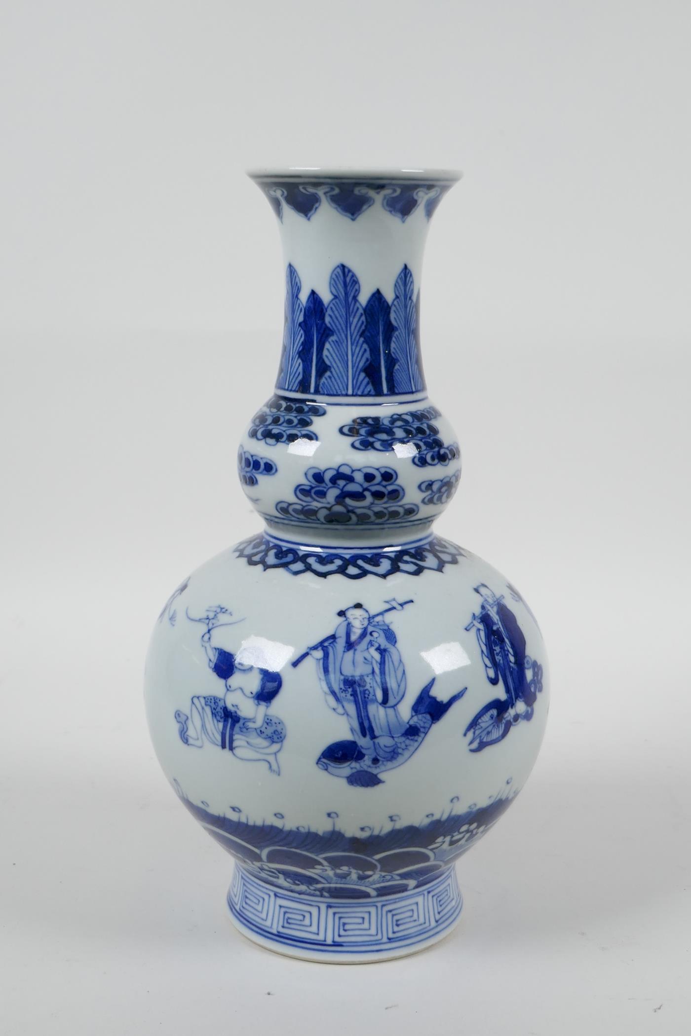 A Chinese blue and white porcelain double gourd vase decorated with the Eight Immortals, 6 character - Image 4 of 6