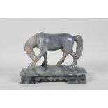 A Chinese carved soapstone figure of a horse, 6½" long, 5" high