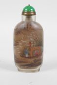 A Chinese reverse decorated glass snuff bottle depicting fishermen, 4" high