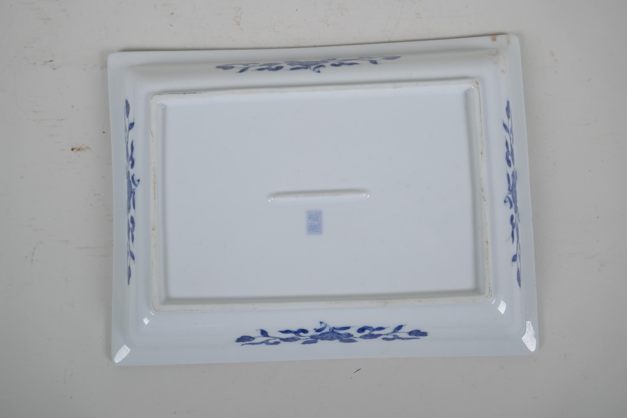 A Chinese blue and white porcelain shallow dish of rectangular form, decorated with a riverside - Image 4 of 5