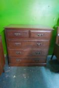 A Victorian oak chest with two over three moulded front drawers and metal plate handles, raised on a
