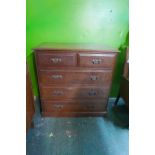 A Victorian oak chest with two over three moulded front drawers and metal plate handles, raised on a