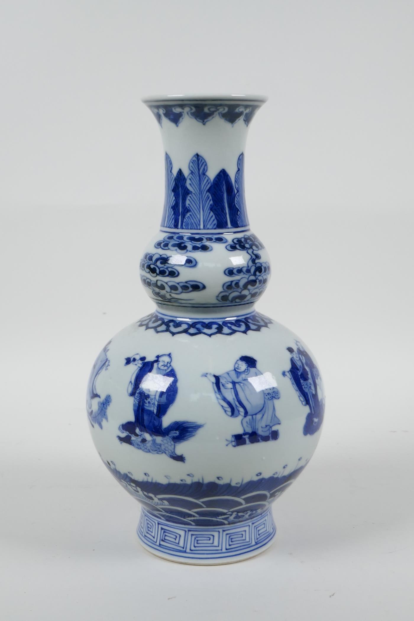 A Chinese blue and white porcelain double gourd vase decorated with the Eight Immortals, 6 character - Image 2 of 6