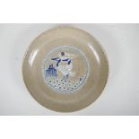 A Chinese crackleware dish with blue and white stork decoration, 10" diameter