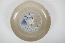 A Chinese crackleware dish with blue and white stork decoration, 10" diameter