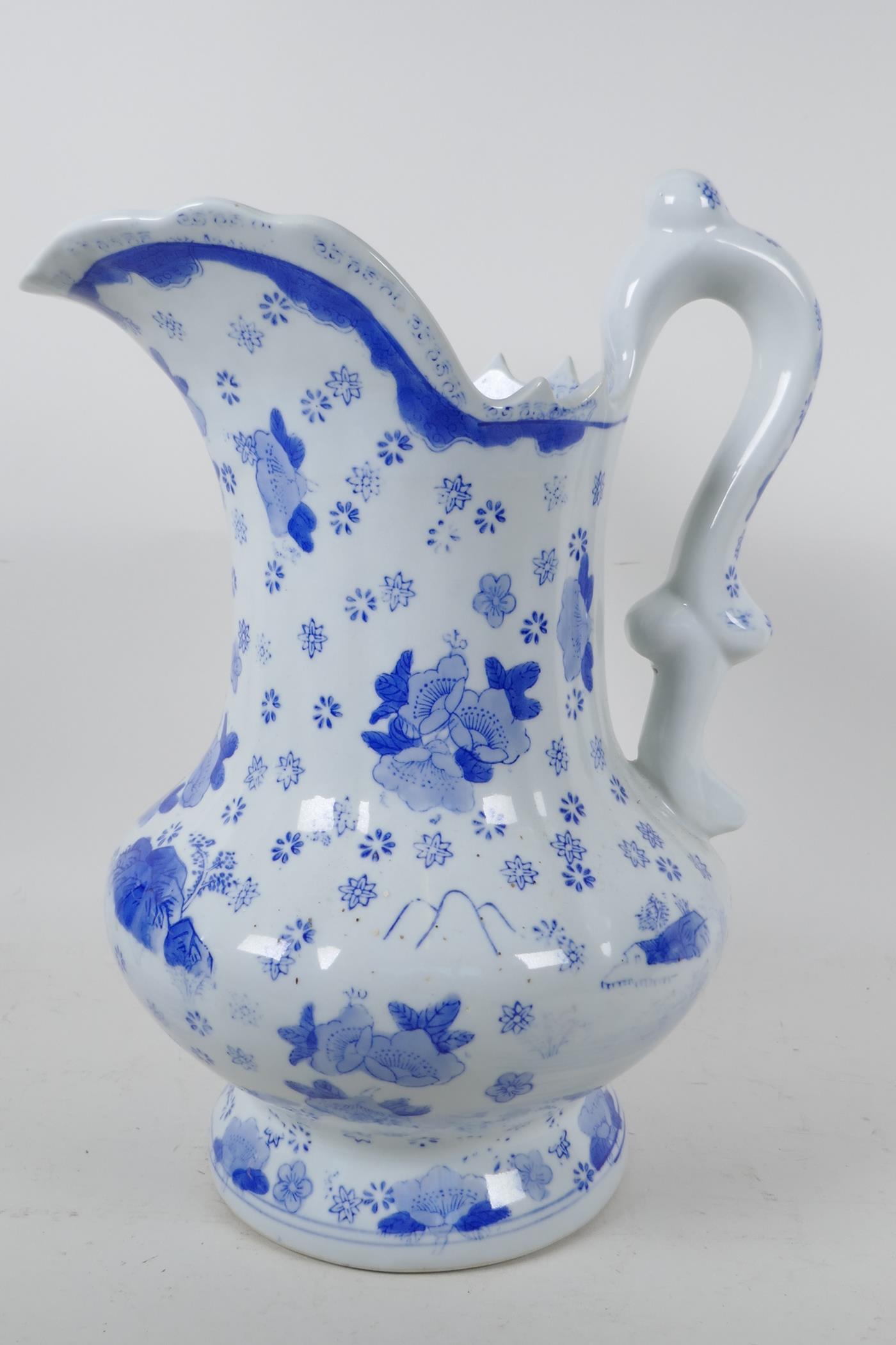 A classical style blue and white pottery ewer decorated with flowers, 12" high - Image 3 of 4