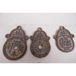 Three Chinese bronze graduated pendants decorated with calligraphy, largest 2¾" long