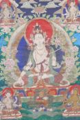 A Sino-Tibetan printed thangka depicting various facets of Buddha, with hand painted embellishments,