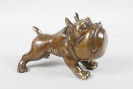 A filled bronze figure in the form of a comical bulldog, 5½" long