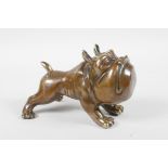 A filled bronze figure in the form of a comical bulldog, 5½" long