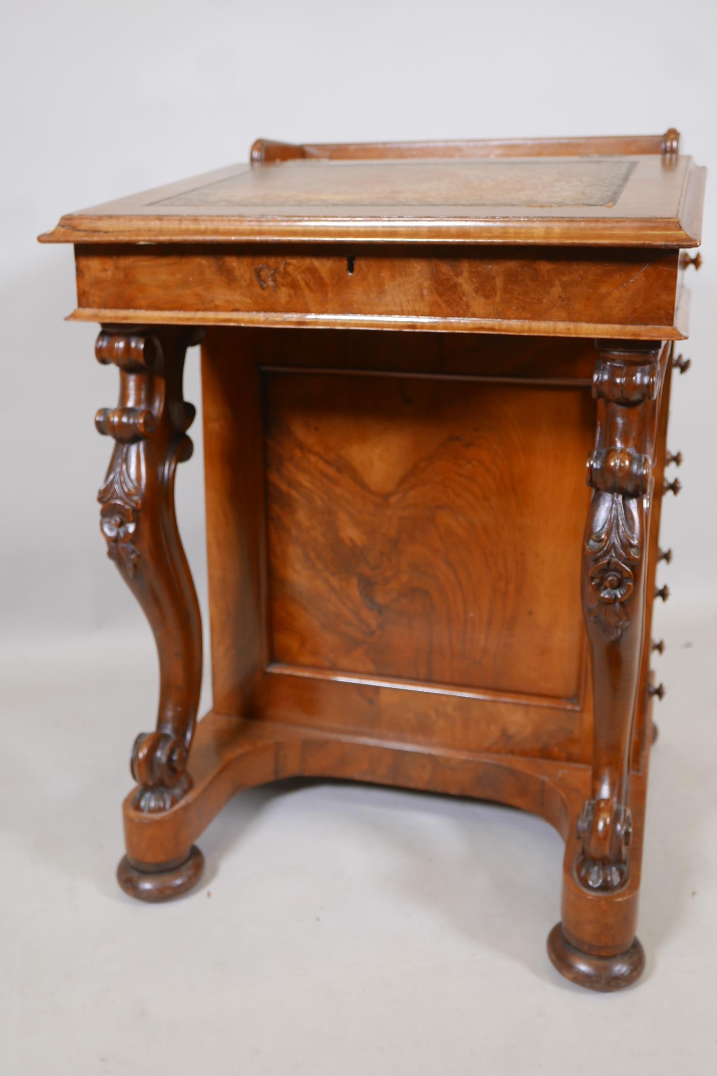 A Victorian figured walnut davenport with carved piano legs, tooled leather inset top and fitted - Image 3 of 9