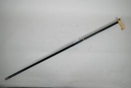 A Victorian dandy's cane, with ebonised shaft and bone handle with pinchbeck mounts inset with