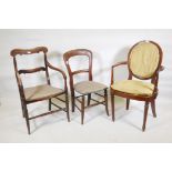 An early C19th spoon back open armchair, together with a C19th elm open armchair with ring turned