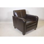 A dark brown leather club armchair on block feet, 30½" high, 29" wide