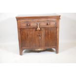 A C19th Dutch mahogany side cabinet with canted ends, pull out slides and lift up top with folding