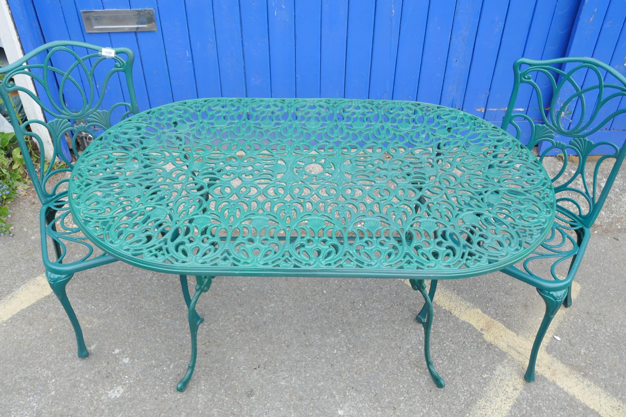 A cast aluminium oval top garden table on shaped legs with undertier together with a pair of - Image 2 of 3