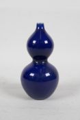 A Chinese powder blue glazed porcelain double gourd stem vase, seal mark to base, 4½" high