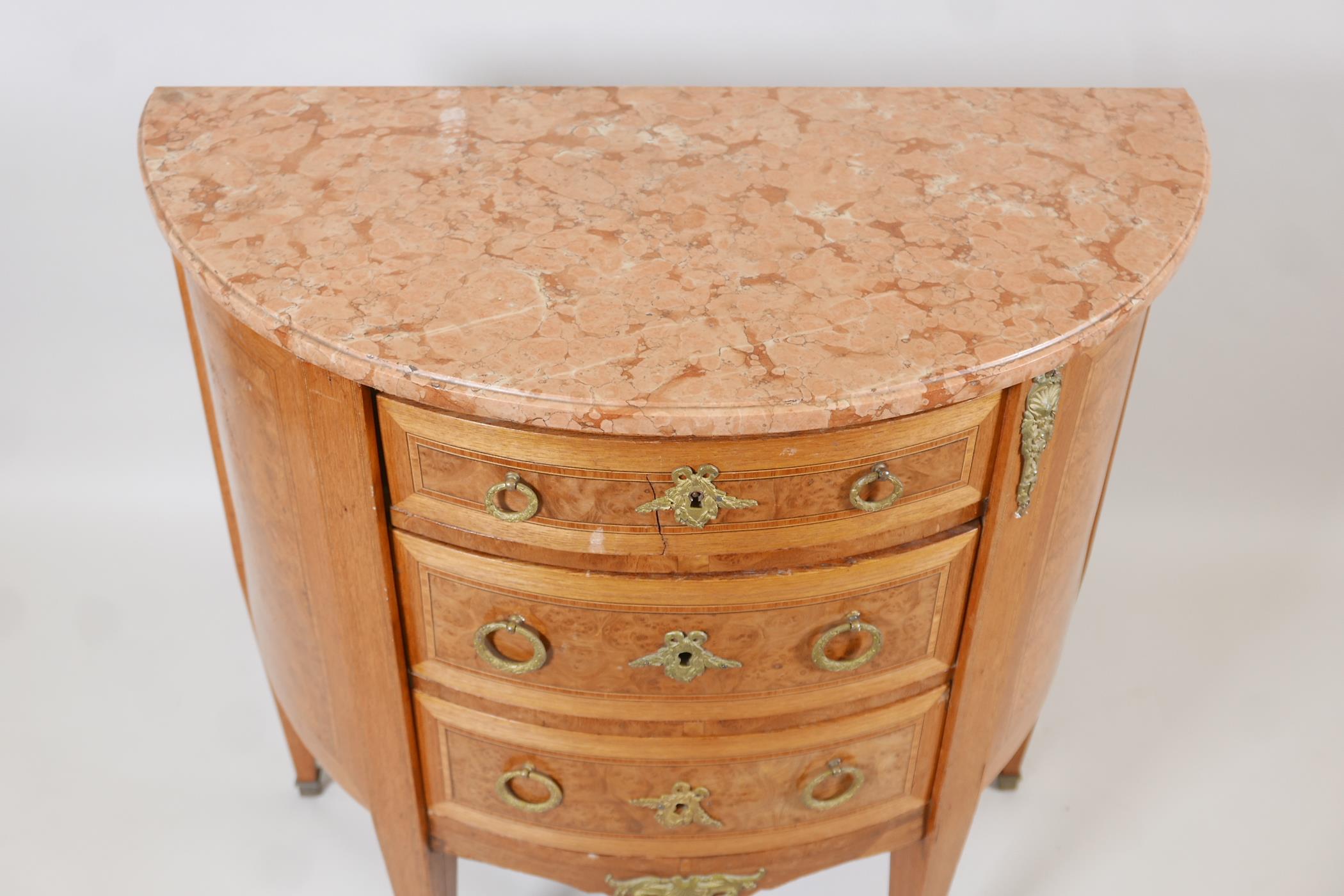 A Louis XV style demi-lune three drawer commode, with inset burr walnut inlaid panels, brass handles - Image 3 of 3