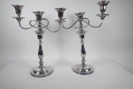 A pair of tall classical style silver plated three light candelabra, 15" high, one A/F