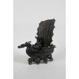 A Chinese bronze censer and cover in the form of a dragon boat, 7" long, 7½" high, A/F repair