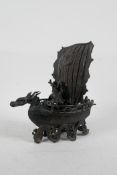 A Chinese bronze censer and cover in the form of a dragon boat, 7" long, 7½" high, A/F repair