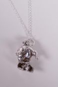 A white metal pendant necklace in the form of a piglet, 1½" drop