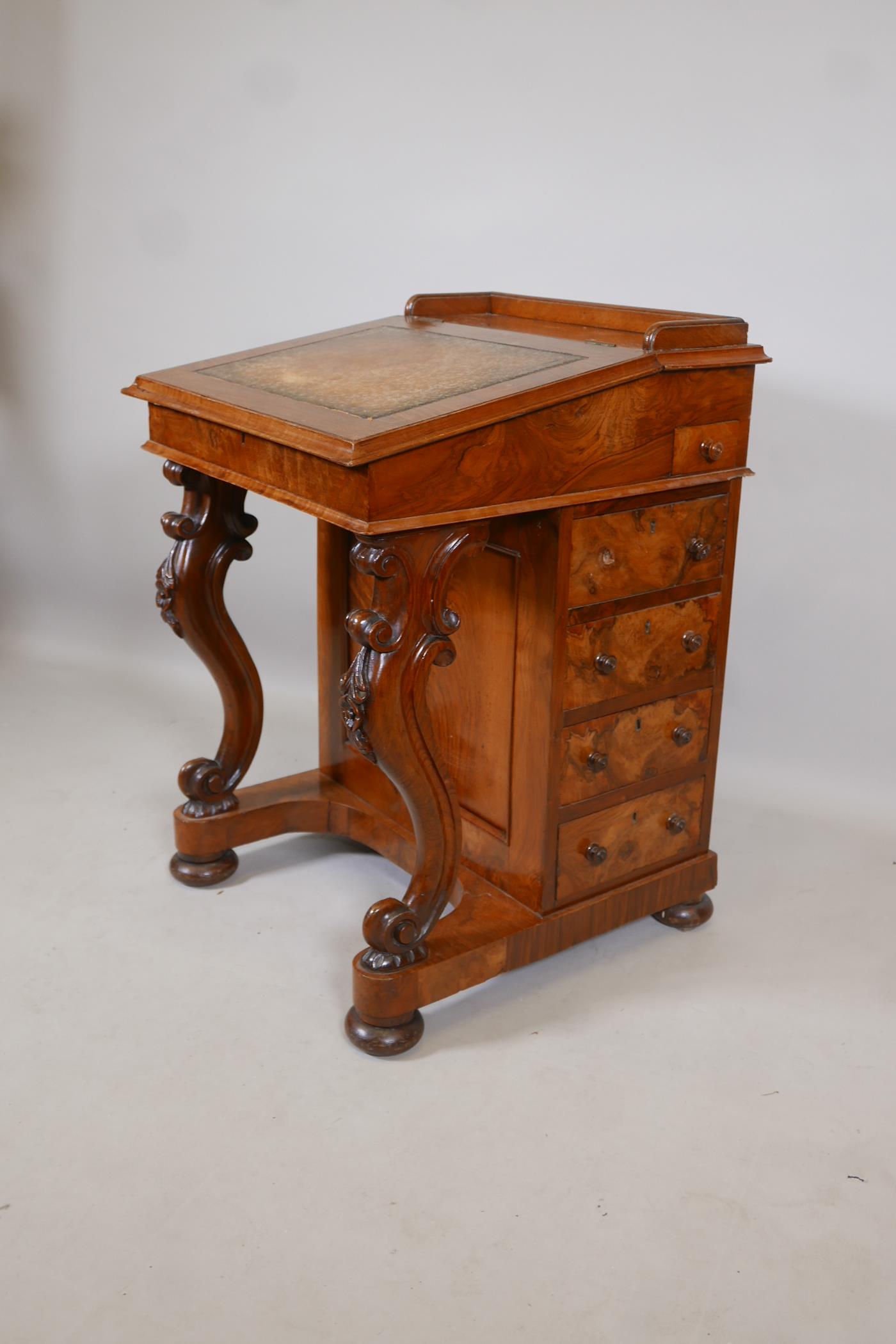 A Victorian figured walnut davenport with carved piano legs, tooled leather inset top and fitted - Image 2 of 9