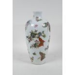 A Chinese polychrome porcelain vase with enamelled butterfly decoration, seal mark to base, 10" high