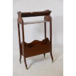 A C19th mahogany book trough with rack and shelf, raised on shaped supports, 22" x 9" x 37"