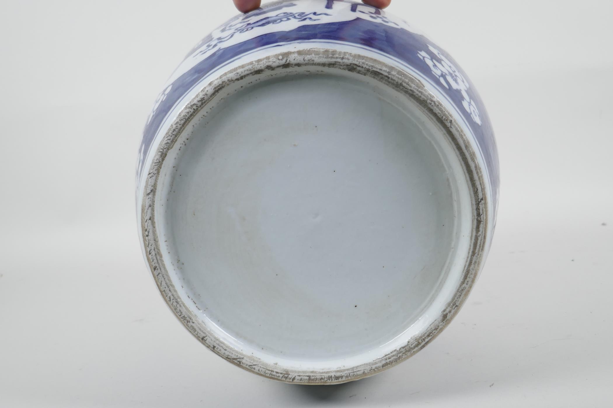 An early C20th Chinese blue and white porcelain jar with decorative panels depicting objects of - Image 3 of 3