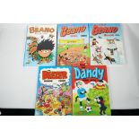 Four children's annuals, The Dandy 1984, The Beano 1984-85 and 1997, and The Beezer 1992