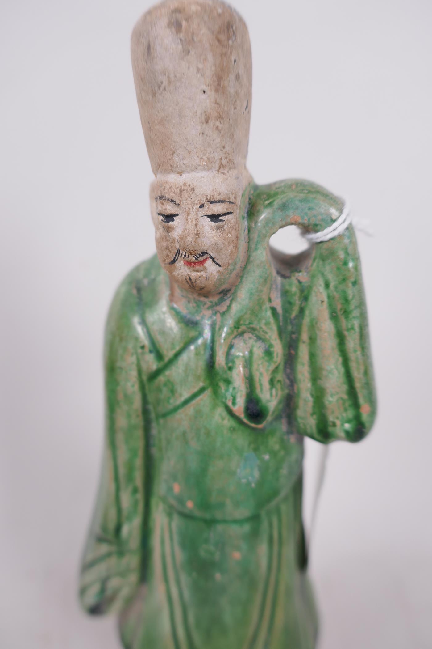 A Chinese Tang dynasty (618-907AD) terracotta figure of a standing male court attendant, Sancai - Image 2 of 4