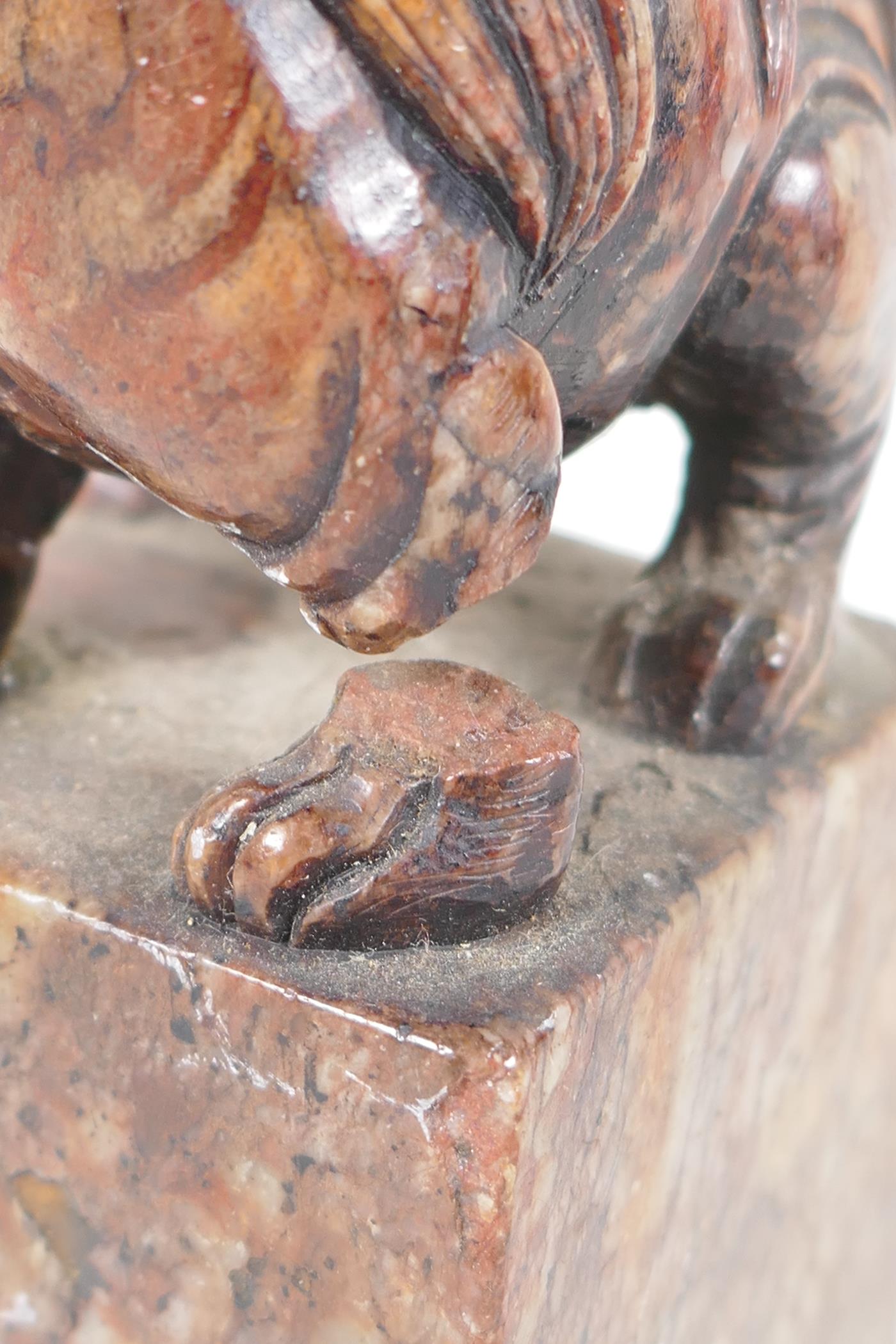 An antique Chinese carved soapstone figure of a kylin standing on a square pedestal, A/F, 5" high - Image 4 of 4