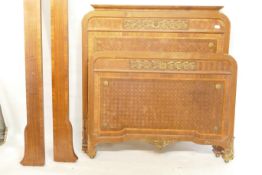 A C19th French walnut bed with parquetry inlaid head and footboard, and ormolu mounts, 49" x 51" x