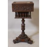 An Anglo-Indian padauk wood workbox, with carved decoration and galleried well, raised on a carved