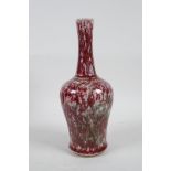 A Chinese mottled red and green porcelain yen yen vase with a slender neck, 9" high