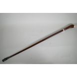 A vintage hardwood walking stick with bone mounts, 35" long