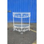 A painted metal demi-lune two tier garden table, 26" x 13", 30" high