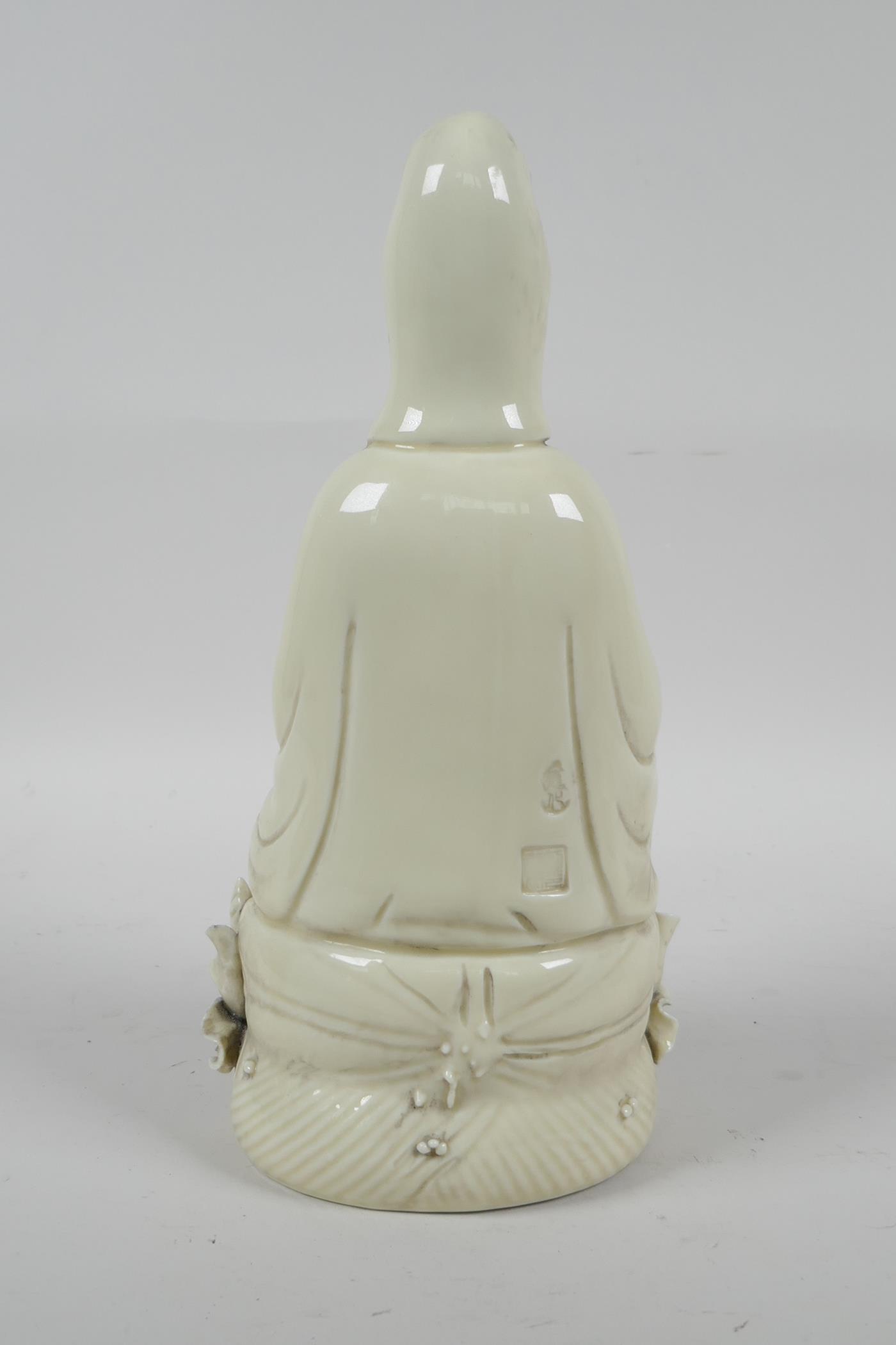 A Chinese blanc de chine porcelain Quan Yin seated on a lotus throne, impressed marks verso, 10½" - Image 4 of 6