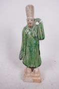 A Chinese Tang dynasty (618-907AD) terracotta figure of a standing male court attendant, Sancai