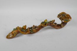 A Chinese sancai glazed porcelain ruyi with peach tree decoration, 13" long